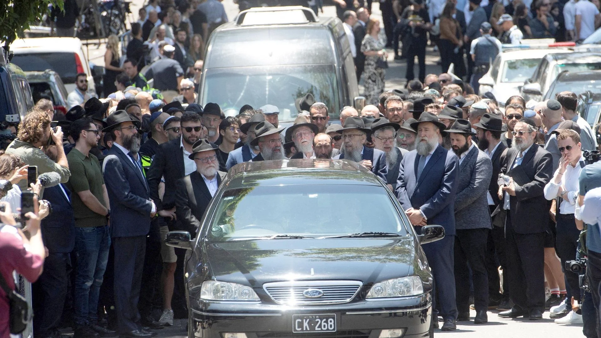  Mourners pay respects at funeral of Bondi attack victim Rabbi Eli Schlanger