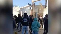 Iran security force member killed during protests, officials say