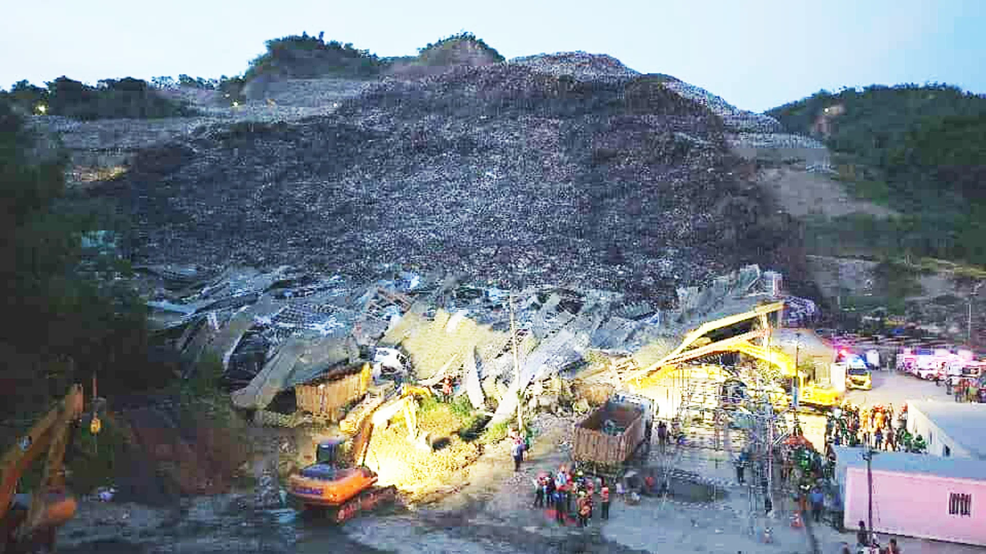 Two dead and 35 missing after landfill collapse sends avalanche of rubbish into village
