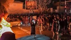Iran warns it will retaliate if US attacks, as hundreds killed in protests