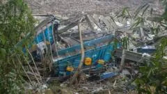 Rescuers race to find dozens missing in deadly Philippines landfill collapse