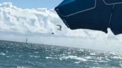 Watch: Paraglider survives 500ft drop into ocean