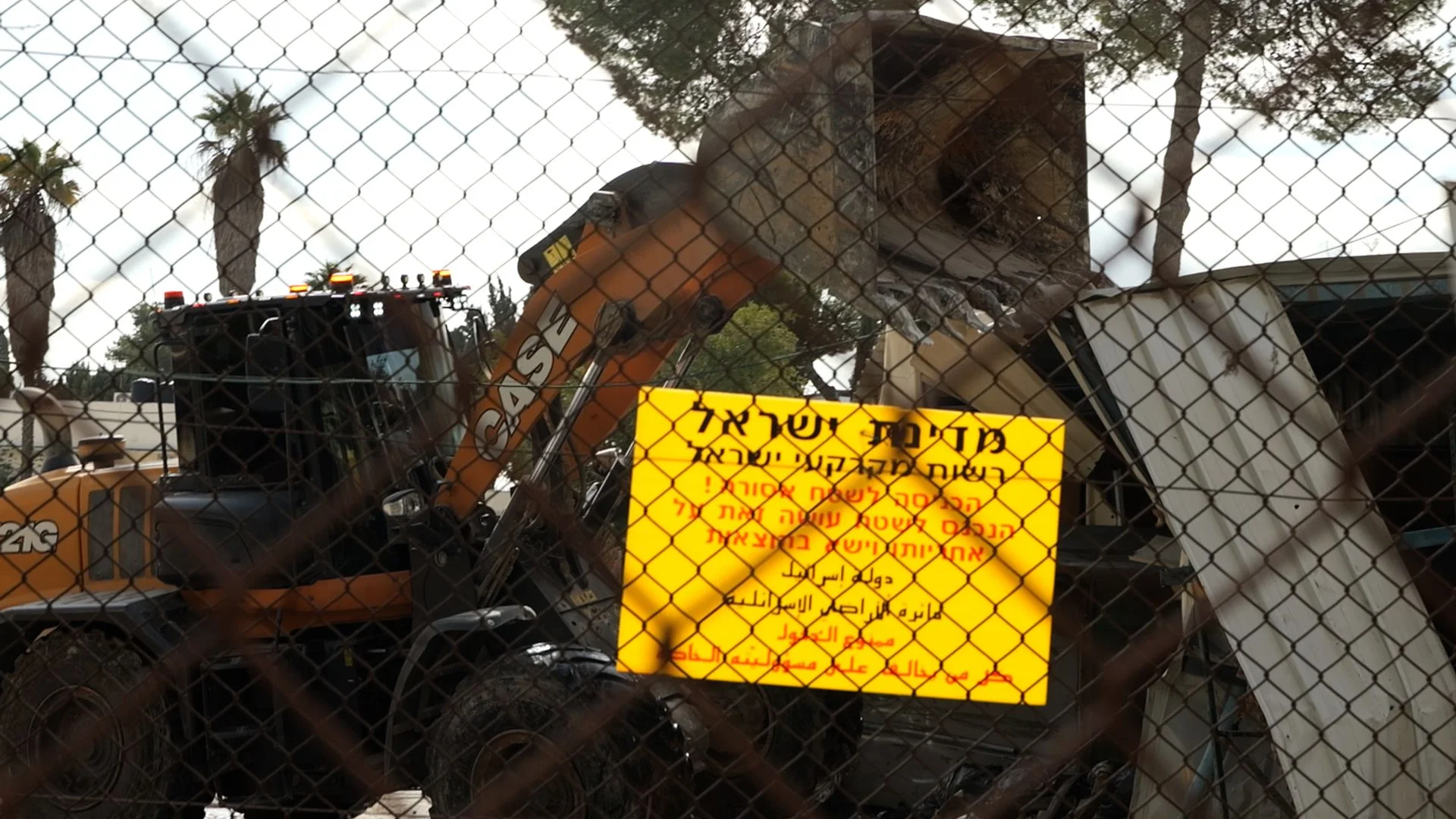 UN accuses Israel of 'unprecedented attack' as diggers start demolishing refugee agency site 