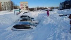 Record snowfall leaves cars stuck and people stranded in Russia's Far East