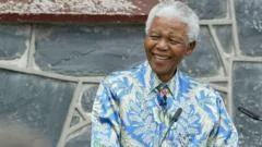 Mandela's prison key, sunglasses and shirt can be sold after daughter wins court battle