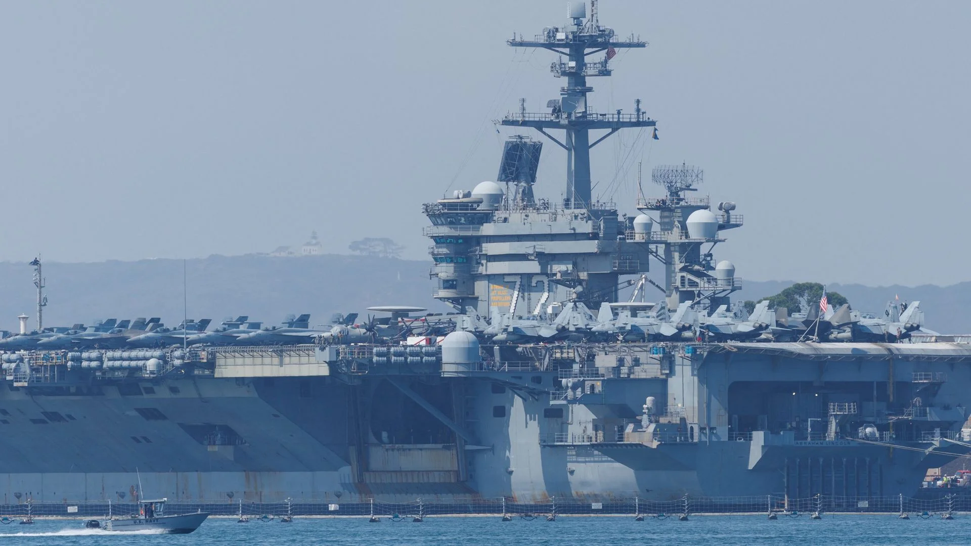 Iran warns any attack will mean 'all-out war' after Trump says US 'armada' on its way