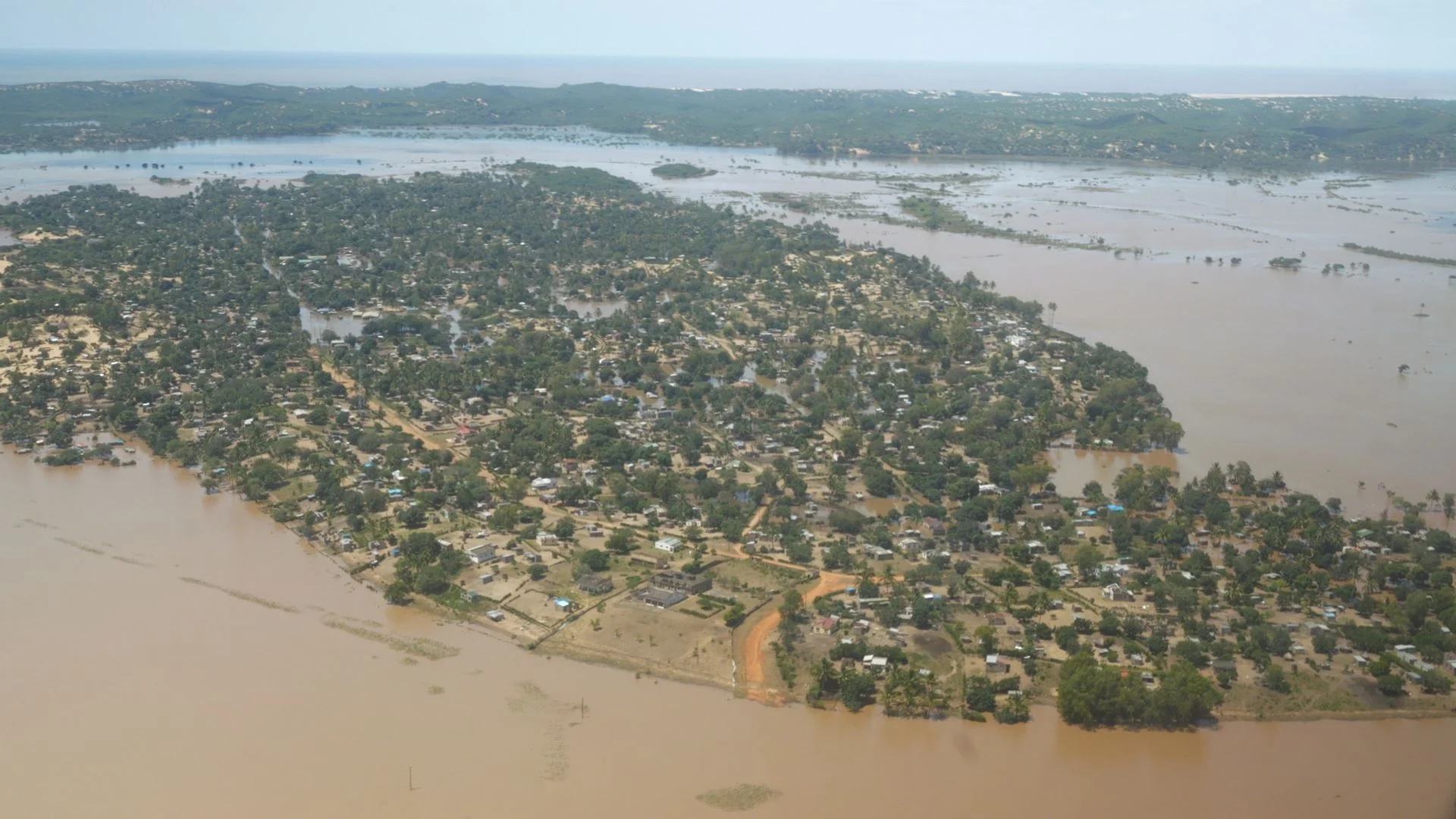 Scramble to reach starving communities in swamp-like conditions after devastating floods
