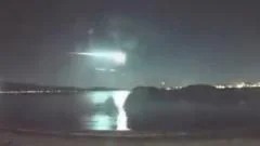 Moment bright light trail streaks across New Zealand skyline