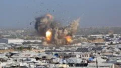 Israeli air strikes kill at least 32 Palestinians in Gaza, rescue officials say
