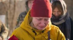 Fearing Russia will seize her town, war widow moves husband's grave to Kyiv