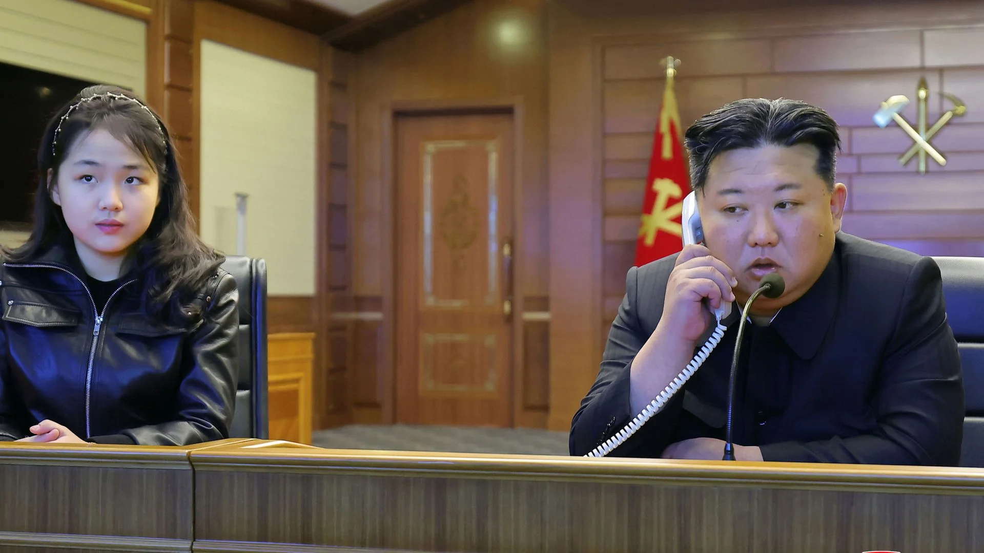 Kim Jong Un watches missile tests with daughter touted as heir