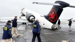 'Like the plane got cut in half': LaGuardia crash that killed two pilots now under investigation