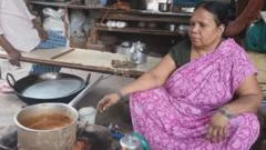 Indian migrant workers hit by cooking gas shortages are leaving cities