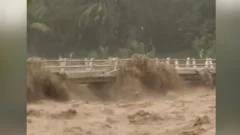Moment Indonesian river overflows from heavy rain