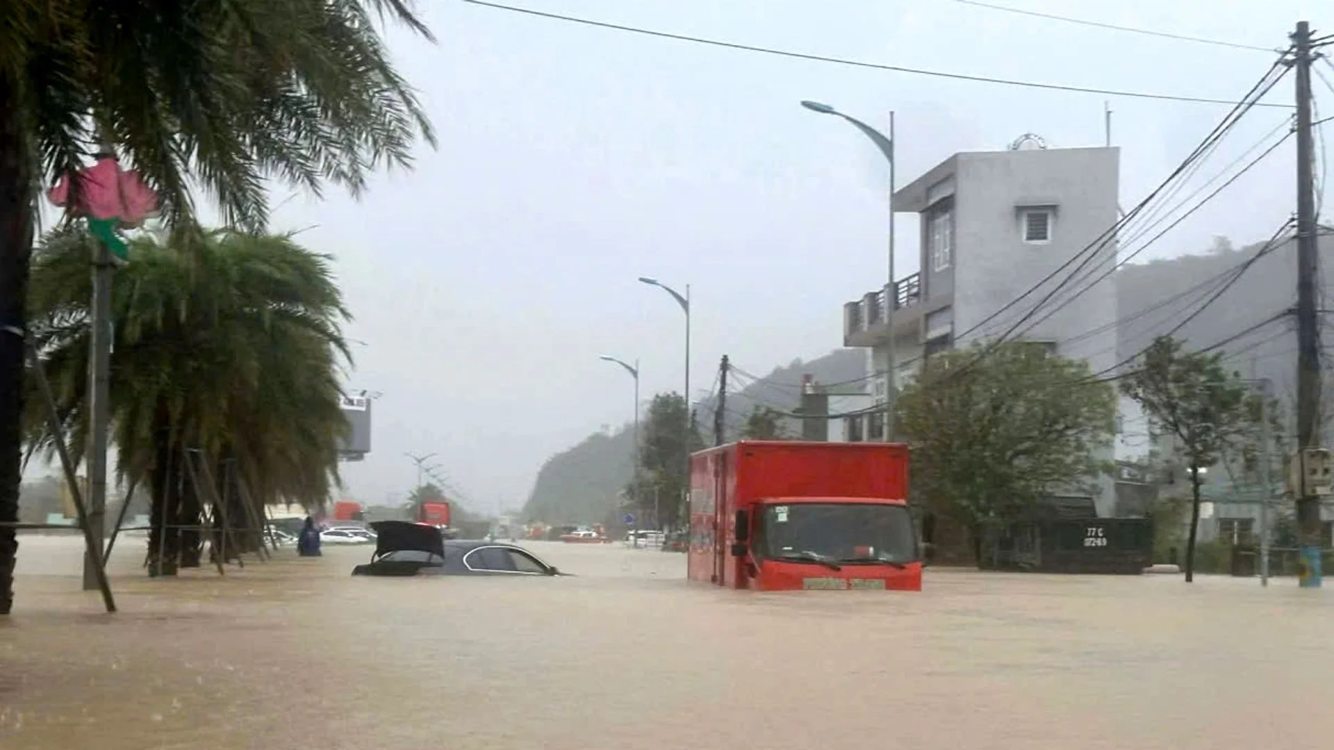 Video shows man rescued by drone as deadly floods hit Vietnam