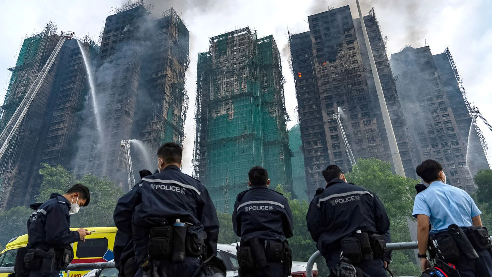 At least 83 dead and hundreds missing as police make arrests over Hong Kong fire