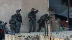 Israeli troops kill two Palestinians after they appear to surrender