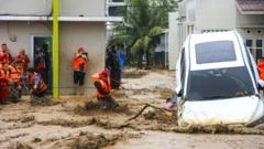 More than 400 killed in Indonesia flooding, officials say