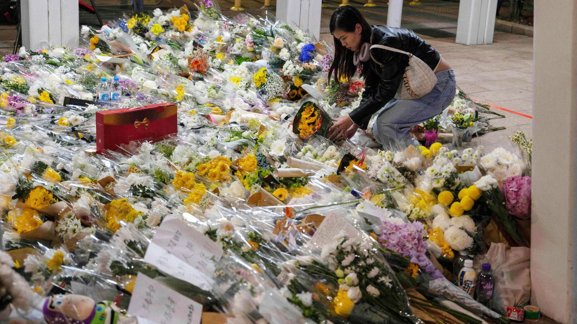Hong Kong mourns those lost to fire as investigators search for remains