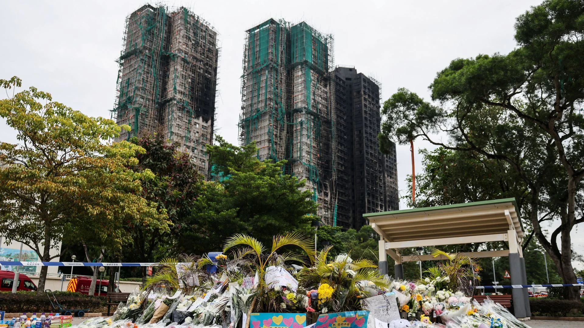 Death toll in Hong Kong apartment complex fire rises as more bodies found in burned buildings