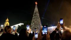 Bethlehem Christmas tree lights up for first time since start of Gaza war