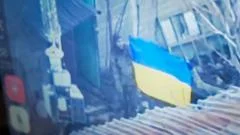 Ukrainians raise flag to show BBC the fight goes on in city claimed by Russia