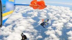 Moment skydiver's parachute wraps around plane tail