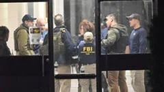 Police release new image as hunt continues for gunman in Brown University shooting